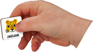 A child's hand holding a magnetic tile featuring a cartoon jaguar with the word 'JAGUAR' printed underneath. The tile is colorful and designed to assist with learning the English alphabet.