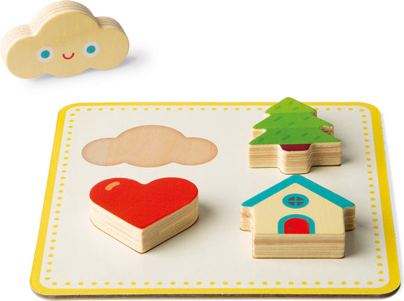 The Memory Touch Recognition Game by Janod features colorful wooden pieces including a heart, a house, a tree, and a smiling cloud. Each piece fits into its corresponding shape on the board, promoting sensory and cognitive development for children. The game has a playful design, perfect for engaging young minds in a fun way.
