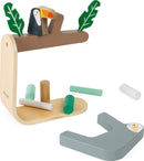 Sloth Balancing Game by Janod featuring a wooden base with a sloth and toucan on a tree branch. Includes various colored cylindrical blocks for balancing.