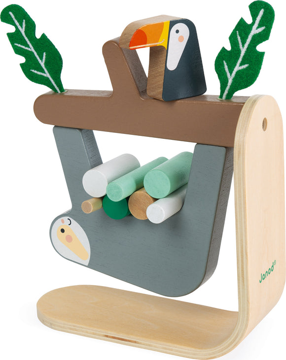 Sloth Balancing Game by Janod, featuring a wooden structure with a toucan on top and colorful wooden sticks to balance. The game is designed for children to improve dexterity and hand-eye coordination.