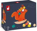 Nutty Balance Balancing Game by Janod features a playful orange squirrel balancing colorful wooden blocks on a surfboard base. Ideal for toddlers, this engaging game promotes fine motor skills and hand-eye coordination while encouraging imaginative play. Suitable for children aged 18 months and up, it's an educational and entertaining addition to any playroom.