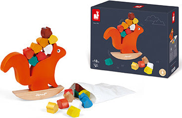 The Nutty Balance Balancing Game by Janod features a vibrant orange squirrel standing on a wooden base, skillfully balancing colorful acorns on its back. The game encourages hand-eye coordination and fine motor skills, suitable for children aged 18 months and up. A canvas bag of multi-colored acorns is also included.