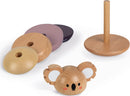 The Koala Stacker & Rocker by Janod features a cute koala head made of wood alongside various colored stacking discs. The wooden pieces promote motor skills and imaginative play.