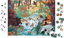 The Footprint Seek & Find Puzzle by Janod features a vibrant and colorful jigsaw scene depicting a lush forest with various animals including deer, foxes, and a boar near a stream, surrounded by trees and foliage. Accompanying the puzzle are circular tokens showcasing animal tracks, enhancing the interactive search experience for kids.