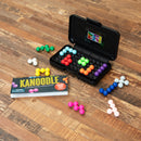 Kanoodle by Educational Insights is a mechanical puzzle game featuring colorful plastic pieces arranged in various configurations. The game includes a compact black case that holds the pieces and a booklet with playful graphics, showcasing the challenge of assembling brain-teasing puzzles. The vibrant pieces in multiple colors, such as red, blue, yellow, green, and purple, create an engaging visual appeal perfect for both kids and adults seeking a mental challenge.