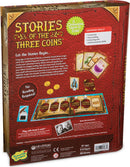 The back of the board game 'Stories of the Three Coins' by Mindware, featuring vibrant illustrations and elements of the game. It highlights the game's cooperative nature, educational skills such as creativity and storytelling, and contains components like a game board, story cards, inkwell tracker, magic coins, and a storytelling stand. The design includes playful graphics suitable for children aged 6 and up, promoting engaging adventures for 2 to 5 players in about 20 minutes.
