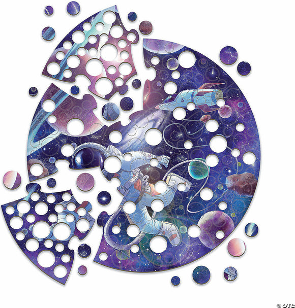 A colorful jigsaw puzzle featuring an astronaut floating in a vibrant outer space setting, with various planets and stars. The puzzle pieces have circular holes, enhancing the space theme.