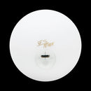 Top view of the Wes Peden LED juggling ball featuring a smooth, white exterior with a golden signature. The ball has a clear, illuminated center, designed for vibrant visual effects during juggling performances.