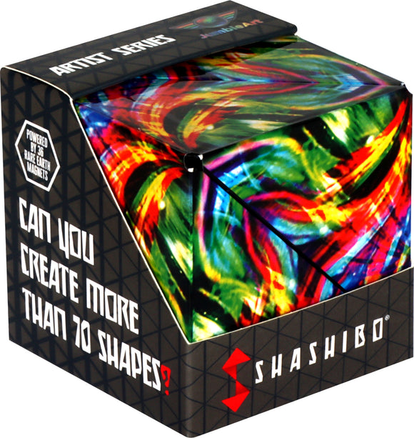 The Shashibo Cosmic Surfer is a vibrant mechanical puzzle featuring a colorful swirling design. The puzzle box showcases instructions asking, 'Can you create more than 70 shapes?' and highlights its 36 rare earth magnets for enhanced playability.