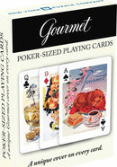 Gourmet Poker Sized Playing Cards by New York Puzzle Company featuring a colorful design on each card. The box showcases the beautiful artwork that represents gourmet cuisine, including a dessert scene and a lavish meal. Suitable for card games and gatherings, these cards are vibrant and elegantly designed, enhancing any game night.