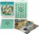 Janet Hill Playing Cards by New York Puzzle Company. The deck features unique illustrations with elegant designs on each card, showcasing a blend of art and gameplay. The colorful box includes assorted cards with various artistic themes, perfect for game nights and collectors alike.