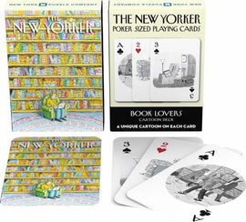 A deck of Book Lover Playing Cards by New York Puzzle Company, featuring colorful illustrations on the packaging and unique cartoons on each card. The box shows a cozy library scene with a person seated in a green armchair. A few cards are displayed, highlighting illustrations that showcase book-themed artwork.