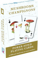Mushrooms Playing Cards by New York Puzzle Company feature a unique deck with poker-sized cards, each displaying a different type of mushroom. The packaging showcases a playful design, highlighting the cards inside, perfect for mushroom lovers and card game enthusiasts alike.