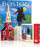 Boston Mini Puzzle by New York Puzzle Company featuring a vibrant cover illustration of Boston's historic landscape with a prominent statue and colorful buildings. The puzzle includes 100 pieces and is designed for puzzle enthusiasts of all ages.