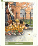 A charming 500-piece jigsaw puzzle titled 'Inch by Inch' by New York Puzzle Company, featuring a whimsical illustration of children lined up in a park, intently observing a small caterpillar on the ground, surrounded by greenery and flowers.
