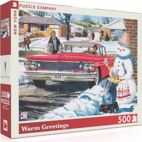 A 500-piece jigsaw puzzle titled 'Warm Greetings' by New York Puzzle Company. The box features a nostalgic winter scene with a vintage red car parked in front of houses, children playing in the snow, and a cheerful snowman. The artwork captures a warm, festive atmosphere reminiscent of classic holiday greetings.