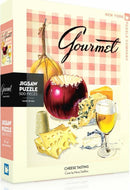 The Cheese Tasting Puzzle box featuring an illustration of various cheeses, a glass of beer, and a checkered background. It is a 500-piece jigsaw puzzle made by New York Puzzle Company. The cover art is by Henry Stahlhut.