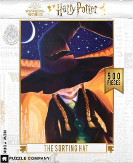 The Sorting Hat Harry Potter Puzzle featuring an illustrated Sorting Hat in a starry night scene. The image shows the iconic hat with a backdrop of the Hogwarts castle and celestial elements, perfect for Harry Potter fans. Contains 500 pieces.