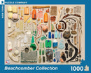 A vibrant jigsaw puzzle featuring an assortment of beachcombed items including plastic bottles, shells, and various colorful debris. The image showcases a visual collage of found objects, emphasizing ocean conservation. The puzzle contains 1000 pieces and is brought to you by New York Puzzle Company.