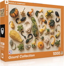 A colorful jigsaw puzzle box featuring a Gourd Collection. The box showcases various types of gourds, including squash and pumpkins, artistically arranged. The puzzle contains 1000 pieces and is made in the USA. The packaging highlights the distinctive shapes and textures of the gourds, appealing to nature and puzzle enthusiasts alike.