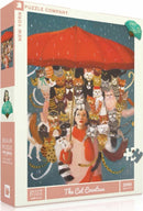The Cat Countess Puzzle by New York Puzzle Company. This 1000-piece jigsaw puzzle features a whimsical illustration of a woman holding a red umbrella surrounded by an array of colorful and playful cats, each adorned in quirky outfits, set against a vibrant background. Perfect for cat lovers and puzzle enthusiasts alike.