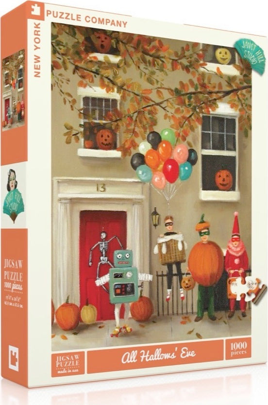 All Hallows' Eve 1000-piece jigsaw puzzle by New York Puzzle Company featuring a whimsical Halloween scene. The image depicts a festive group of characters dressed in costumes, including a robot, a pumpkin, and a skeleton, set against a background of a charming house adorned with pumpkins and colorful balloons, capturing the spirit of Halloween.