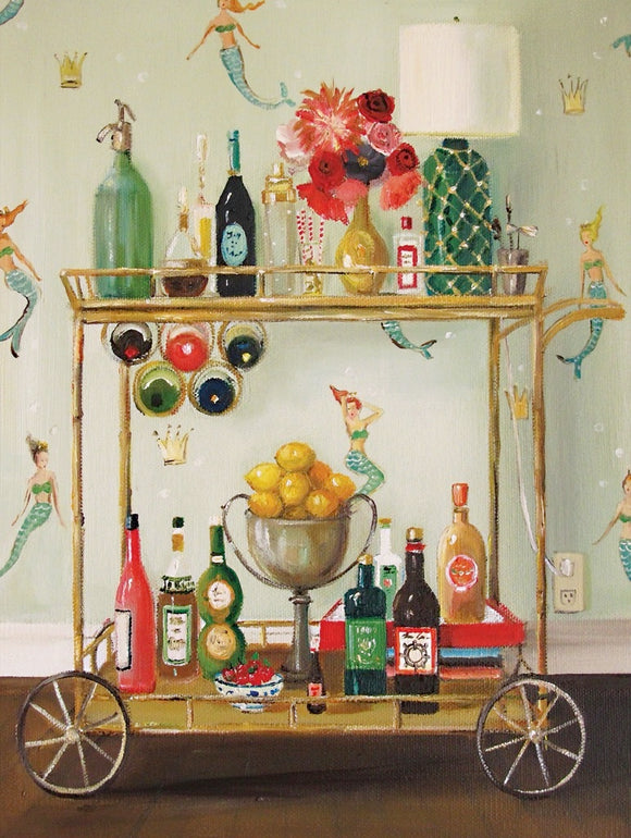 A vibrant jigsaw puzzle titled 'Bar Maids Janet Hill' by New York Puzzle Company. The image features a beautifully arranged bar cart with various colorful bottles, a shiny silver bowl filled with fresh lemons, and a floral arrangement atop the cart. The background is decorated with whimsical mermaids and crowns, adding a playful touch to the scene.