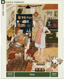 A colorful jigsaw puzzle titled 'Nest' by New York Puzzle Company, featuring a cozy kitchen scene with a pregnant woman and a child surrounded by various kitchen items, a chicken, and warm colors. The artwork depicts a lively atmosphere filled with homely details, ideal for puzzle enthusiasts.