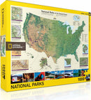 A vibrant jigsaw puzzle box titled 'American National Parks' from the New York Puzzle Company. The puzzle features a detailed map of national parks in the United States, highlighted in rich colors, with images of iconic landmarks from various parks surrounding the map. The box displays the National Geographic logo and indicates it contains 1000 pieces, perfect for nature and adventure enthusiasts.