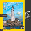 Boston Islands Mini Puzzle featuring a picturesque lighthouse against a map background, showcasing the vibrant blue waters and rocky coastline. This 100-piece jigsaw puzzle by New York Puzzle Company offers a delightful challenge for puzzle enthusiasts and lovers of Boston's scenic beauty.