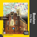 Boston City Map Mini Puzzle (100 pieces) featuring a detailed map of Boston overlaid with a historic building. The jigsaw puzzle showcases vibrant colors and intricate landmarks, perfect for puzzle enthusiasts and city lovers alike.