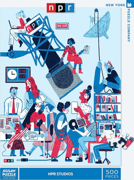 NPR Studios jigsaw puzzle featuring a colorful illustration of various radio station activities, including a microphone, people interacting with equipment, and a blue and red color scheme. The puzzle contains 500 pieces and is made by the New York Puzzle Company.