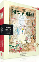 A colorful 1000-piece jigsaw puzzle titled 'Bicycle Shop,' featuring a whimsical illustration by Jean-Jacques Sempé. The image depicts a busy bicycle shop scene from the New Yorker magazine, filled with various bicycles, a shopkeeper, and customers. The puzzle box is designed in soft pastel colors with the title prominently displayed.