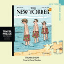 A 100-piece jigsaw puzzle featuring the 'Trunk Show' cover by Danny Shanahan from The New Yorker. The illustration depicts children at the beach wearing colorful swim trunks, with the ocean and sky in the background. The puzzle is part of New York Puzzle Company's travel puzzle collection, designed for on-the-go enjoyment.