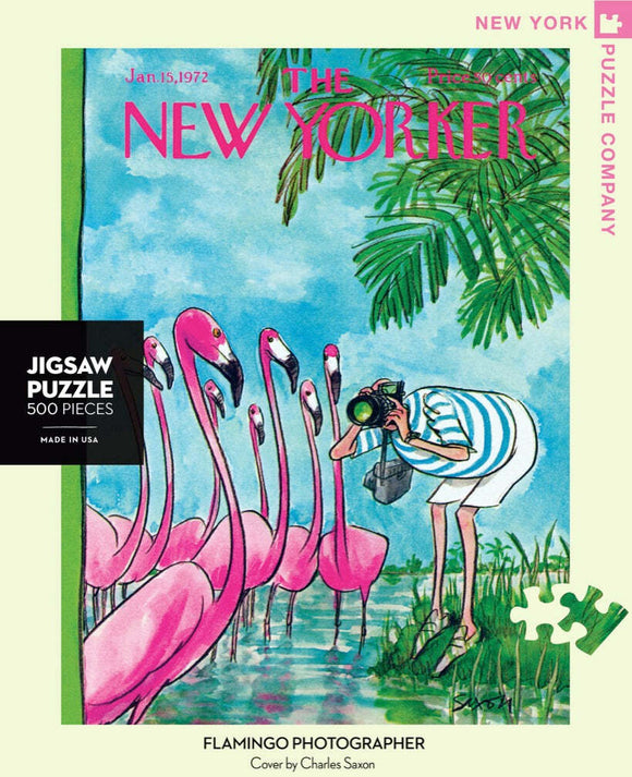 A vibrant jigsaw puzzle featuring a whimsical illustration of a person taking photographs of flamingos by a water body. The artwork showcases pink flamingos surrounded by lush greenery, capturing the playful essence of nature. Designed by Charles Saxon for The New Yorker, this 500-piece puzzle offers a delightful challenge and a beautiful scene once completed.