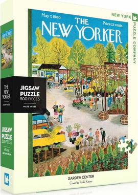 A colorful jigsaw puzzle box featuring a serene garden center scene, illustrated by Ilonka Karasz. The puzzle contains 500 pieces and showcases people interacting in a vibrant garden setting with flowers and plants. The box is branded with The New Yorker magazine logo.