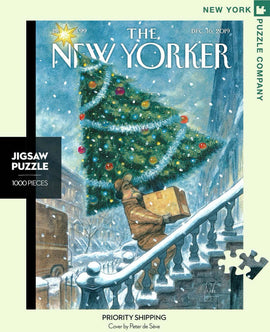 A colorful jigsaw puzzle featuring a winter scene with a delivery man carrying a box up snowy stairs, set under a decorated Christmas tree, inspired by a New Yorker cover by Peter de Sève. The puzzle contains 1000 pieces and showcases a charming, festive illustration perfect for cozy gatherings.