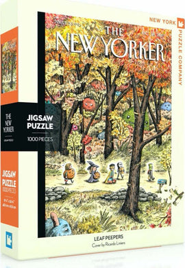 Leaf Peepers 1000-piece jigsaw puzzle by New York Puzzle Company featuring a vibrant autumn landscape filled with whimsical characters. The cover art, illustrated by Ricardo Liniers, showcases a colorful mix of trees, flora, and playful figures amidst falling leaves.