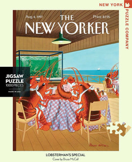An engaging 1000-piece jigsaw puzzle titled 'Lobsterman's Special,' featuring a whimsical illustration of lobsters dining at a table with a checked tablecloth. The setting showcases a vibrant seaside scene, capturing a humorous moment in a New Yorker magazine cover by Bruce McCall from August 4, 1997. The puzzle box is presented with clear labeling, and it is made in the USA by New York Puzzle Company.