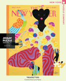 A vibrant 1000-piece jigsaw puzzle titled 'Trendsetters' by New York Puzzle Company, showcasing a colorful artistic illustration featuring a stylish figure with bold patterns and textures. The puzzle design incorporates elements of fashion and creativity, making it an engaging activity for adults and puzzle enthusiasts.