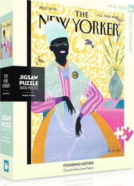 Founding Mother 1000-piece jigsaw puzzle featuring an artistic cover design by Grace Lynne Haynes, showcasing a figure in a vibrant dress with a colorful background. The packaging highlights the collaboration with The New Yorker.