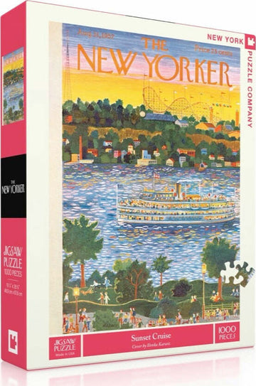 The Sunset Cruise Puzzle by New York Puzzle Company features a vibrant jigsaw puzzle design inspired by a New Yorker magazine cover. The scene depicts a serene sunset over a river with a steamboat, surrounded by lush trees and colorful buildings. It includes 1000 pieces, perfect for puzzle enthusiasts and collectors.