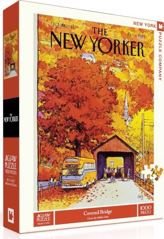 The Covered Bridge Puzzle, a 1000-piece jigsaw by New York Puzzle Company, features a vibrant autumn scene illustrated by Arthur Getz. The box showcases a picturesque covered bridge surrounded by colorful fall foliage, a vintage bus, and people enjoying the serene landscape.