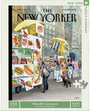 A jigsaw puzzle titled 'Sidewalk Connoisseurs' featuring an illustrated scene with food stalls and vendors reminiscent of New York's sidewalk culture. The cover, illustrated by Victoria Tentler-KRYLOV, shows people browsing through various food items and art while a dog is present in the foreground. This puzzle comprises 1000 pieces, providing a fun and engaging challenge for puzzle enthusiasts.
