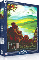Oasis in Space Puzzle (1000pc) by New York Puzzle Company featuring a colorful illustration of a couple by a serene lake surrounded by mountains and trees. The box showcases the theme 'Visions of the Future' and emphasizes the beauty of Earth as a place where 'the air is free and breathing is easy.'