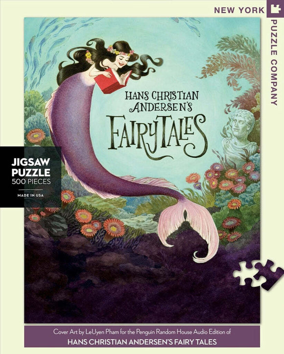 A beautifully illustrated 500-piece jigsaw puzzle featuring cover art from Hans Christian Andersen's Fairy Tales. The artwork depicts a mermaid reading a book amidst a colorful underwater scene, with vibrant flowers and serene background elements. Made in the USA by New York Puzzle Company.
