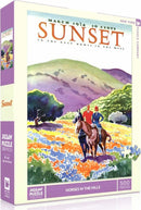 A beautifully illustrated 500-piece jigsaw puzzle titled 'Horses in the Hills' by New York Puzzle Company. The box features vibrant colors depicting two riders on horseback surrounded by lush hills and meadows, with a vintage design referencing a March 1934 Sunset magazine. Perfect for art lovers and puzzle enthusiasts, this puzzle offers a delightful challenge.