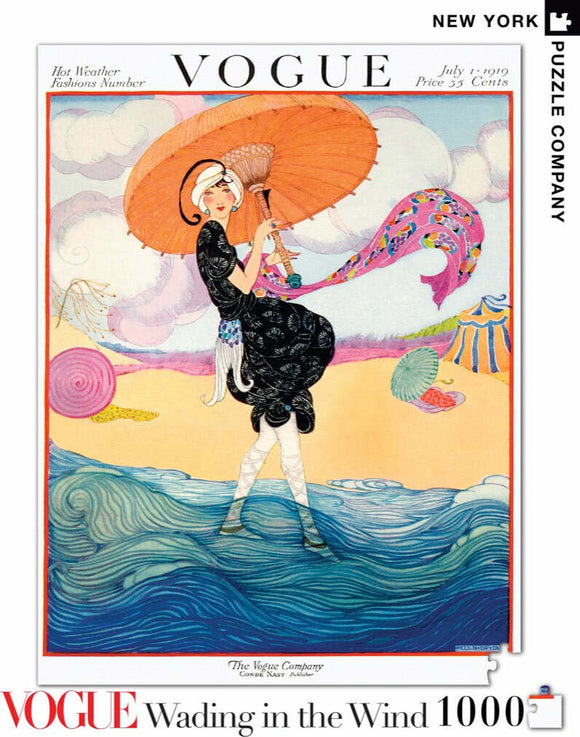 A 1000-piece jigsaw puzzle featuring a vintage Vogue magazine cover from July 1919. The illustration portrays a woman in a black dress holding an orange parasol, with flowing waves and pastel-colored clouds in the background, depicting a whimsical seaside theme.