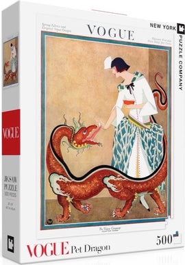 The Pet Dragon Puzzle (500pc) by New York Puzzle Company features a beautifully illustrated cover depicting a vintage Vogue design. It shows a fashionable woman interacting playfully with a whimsical dragon, set against a soft, warm background. The puzzle consists of 500 pieces and promises an engaging challenge for puzzle enthusiasts.