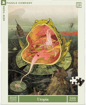 Utopia jigsaw puzzle by New York Puzzle Company featuring a whimsical illustration of a large frog with a vibrant, imaginative landscape inside its mouth, surrounded by elements of nature and urban structures. The puzzle contains 500 pieces and is designed for assembly by puzzle enthusiasts.